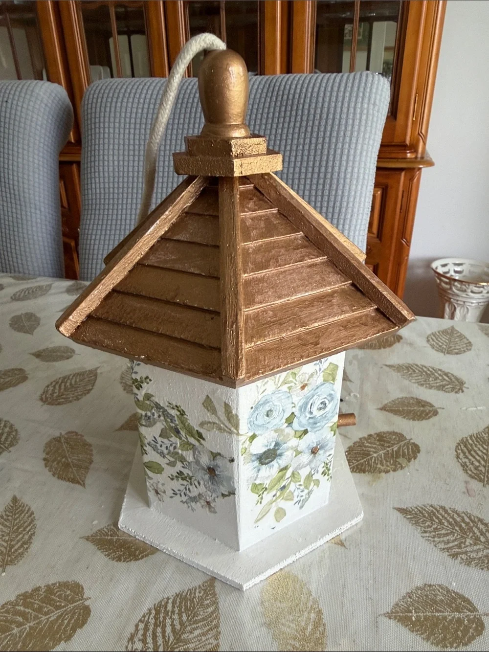 White Birdhouse with Gold Roof and Blue Floral Accents wooden